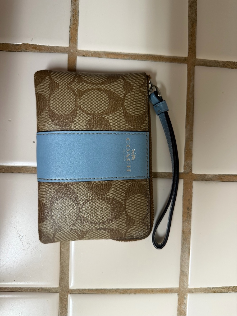 Coach Brown Signature Wristlet with Light Blue Center Stripe